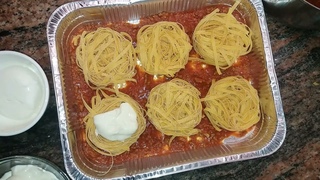 NIDI DI TAGLIATELLE AL FORNO CON RAGU’ E BESCIAMELLA
